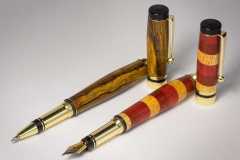 A Cocobolo pen and a fountain pen turned by Mike Feeney composed of Yellow Heart, Red Heart, and Padauk woods.